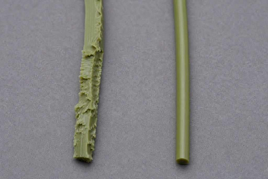 Two different TPU filaments are shown side by side, one textured and rough, the other smooth and cylindrical.